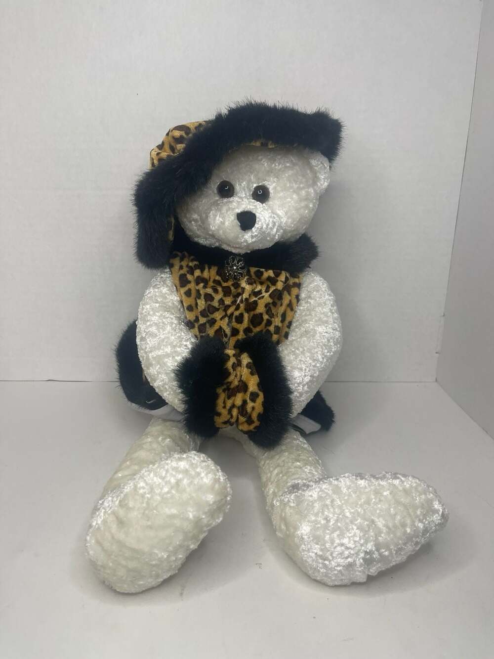 Chantilly Lane PBC Animated Singing White Teddy Bear in Leopard Print Outfit